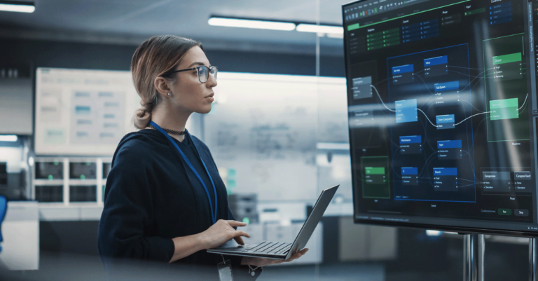 Woman with a laptop on her hands looks at a screen showing a marketing strategy developed with the use of AI.