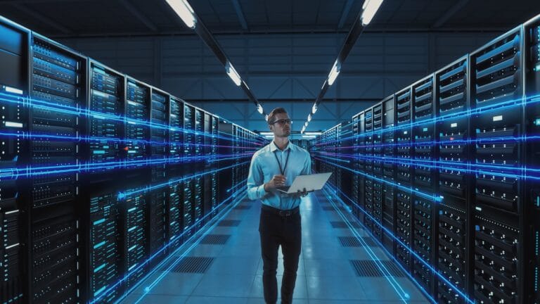 Data scientist managing AI governance in a modern server room with interconnected systems and glowing data streams, representing the operational infrastructure behind AI systems.